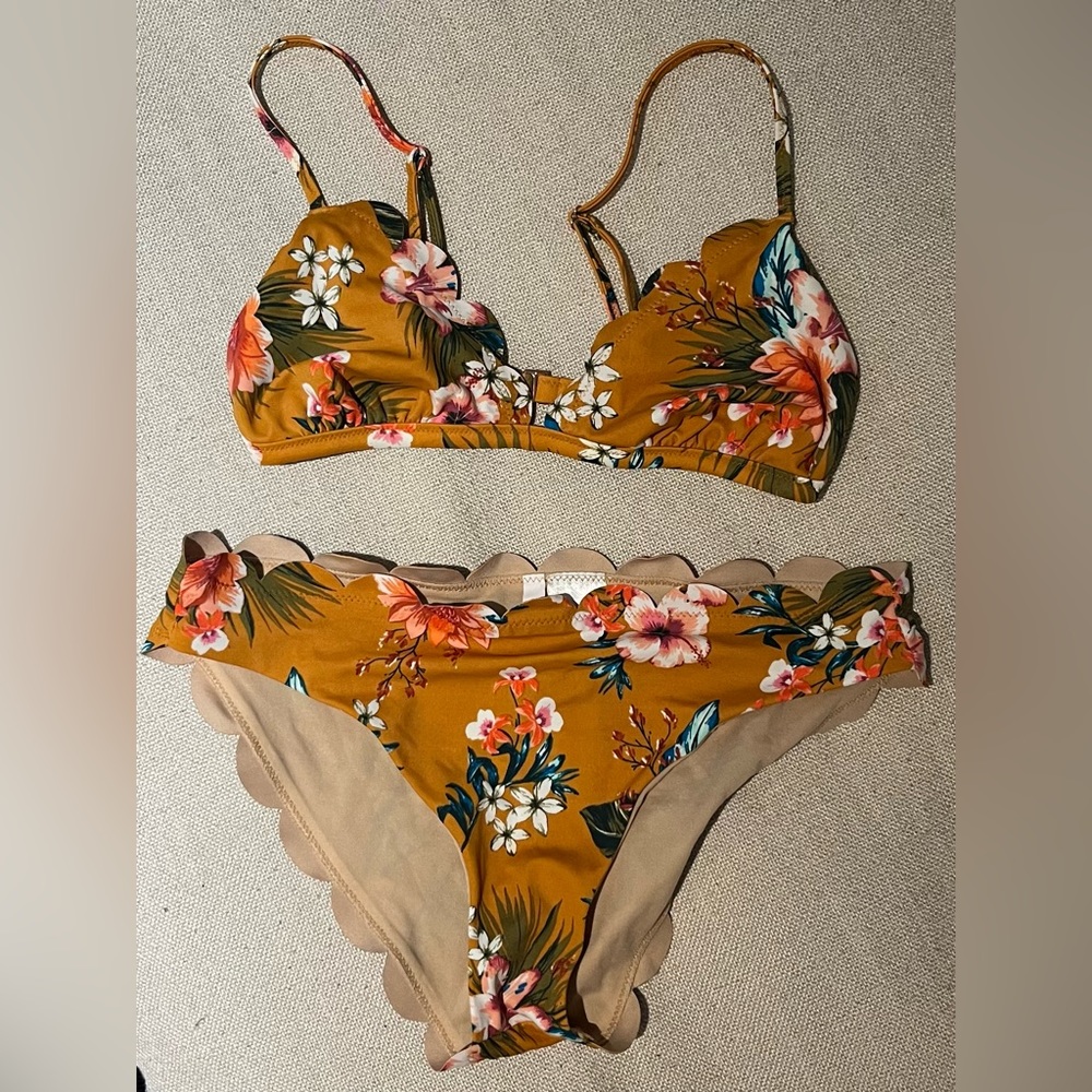 Small bathing suit top with medium bathing suit bottoms